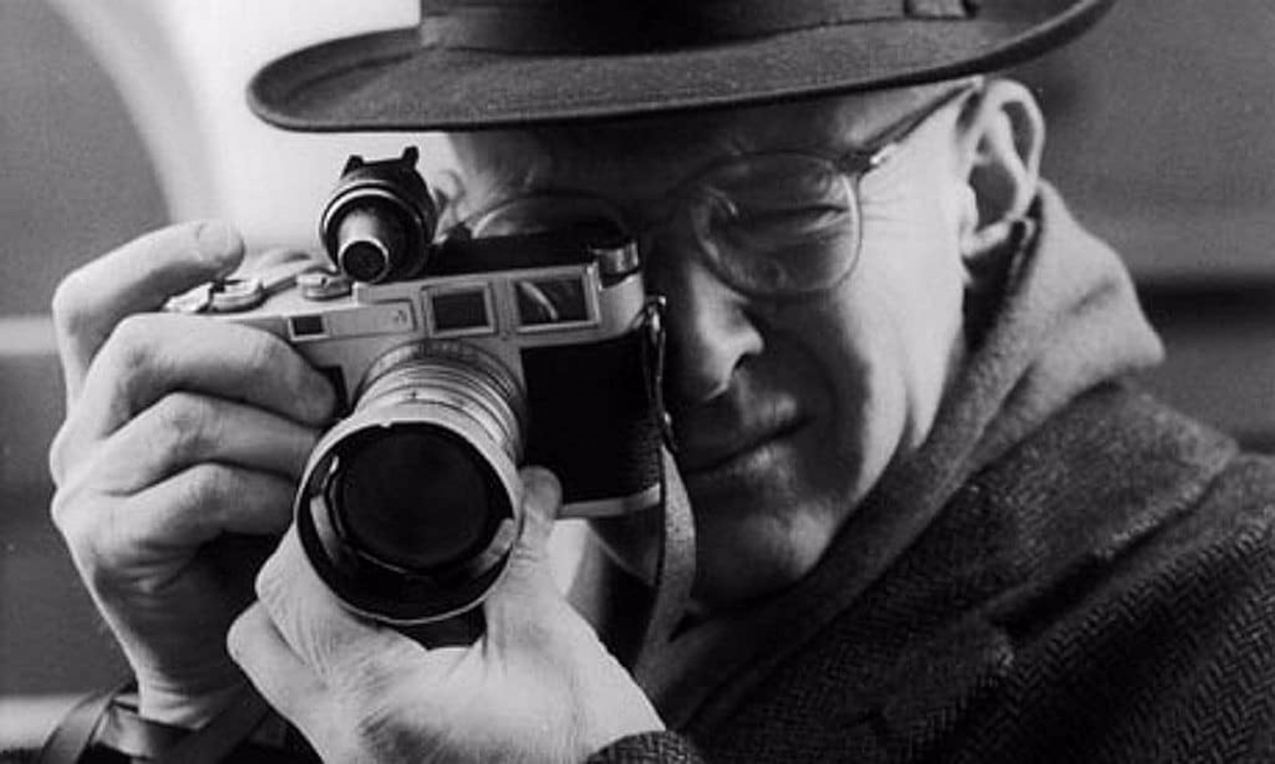 Henri Cartier-Bresson with his Leica camera