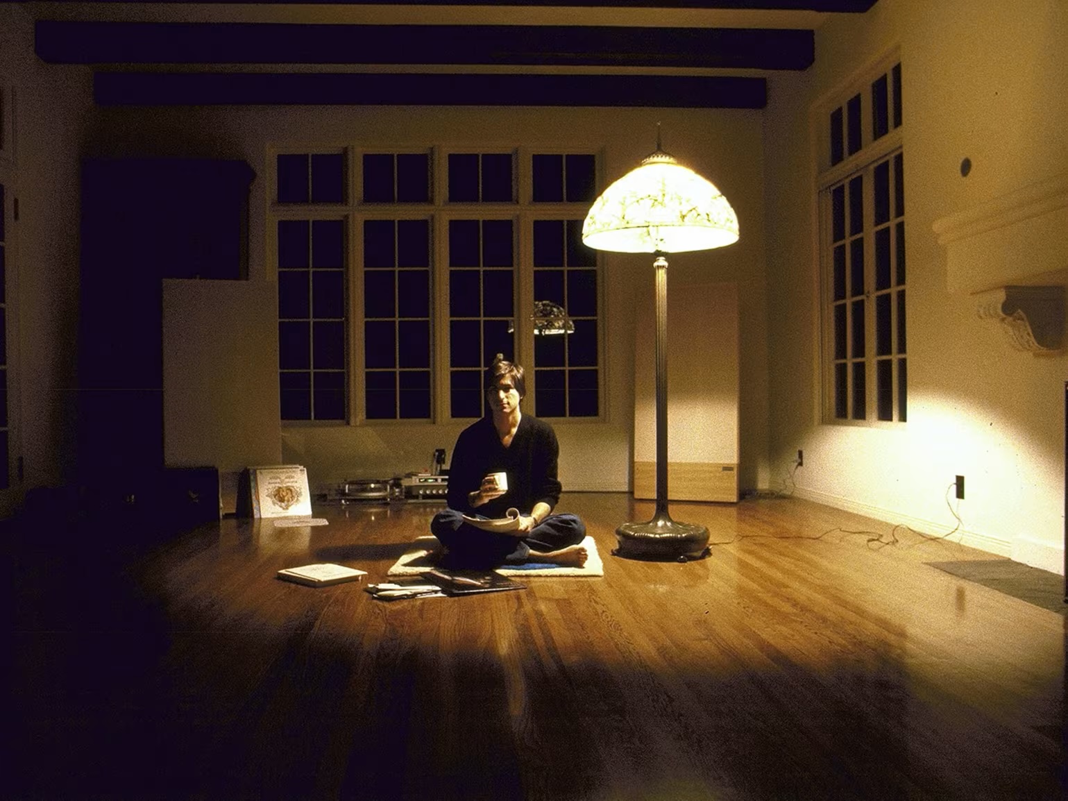 Steve Jobs sitting on the floor of his Woodside home, 1982