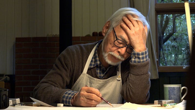 Hayao Miyazaki drawing at his desk at Studio Ghibli