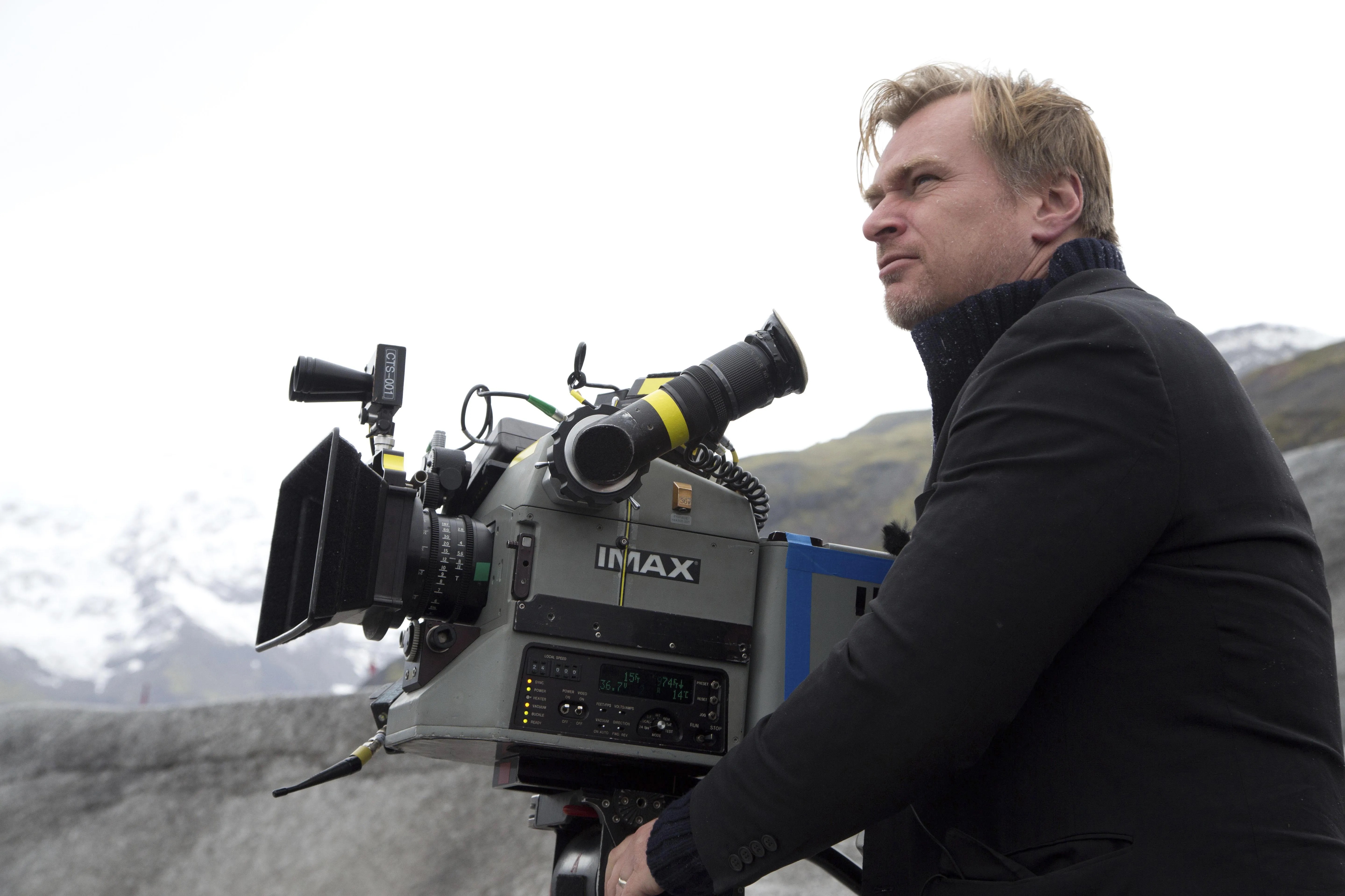 Christopher Nolan behind an IMAX camera on the set of Interstellar