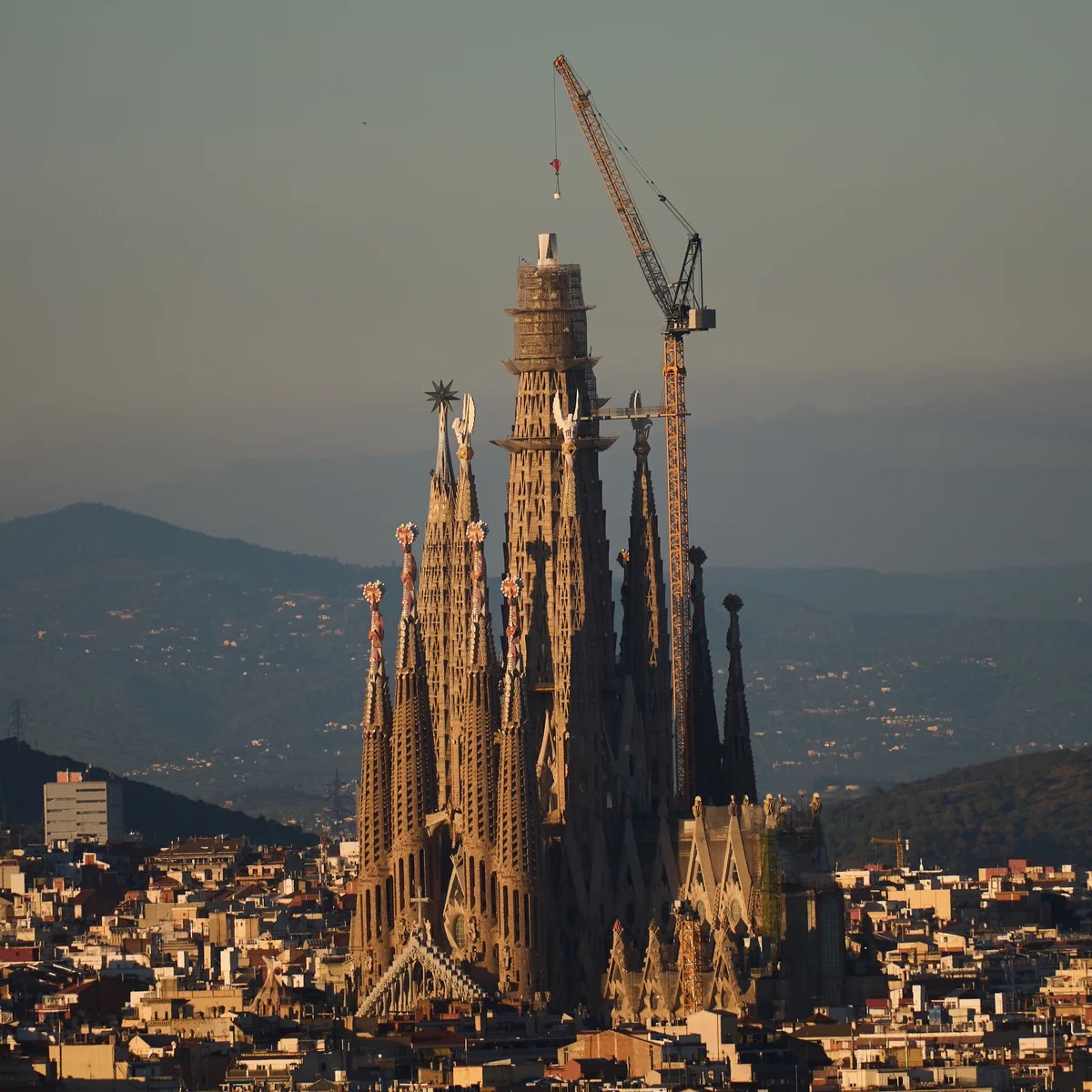 La Sagrada Familia in Barcelona with construction cranes